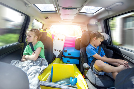 Siblings Arguing In The Car During A Long Car Journey