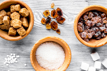 sugar lumps for sweet food cooking on kitchen gray table top vie