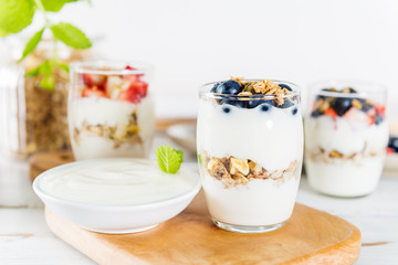 Little Jars with layered dessert from natural yogurt, granola an