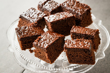 Homemade Moist Chocolate Sponge Cake Brownie Pieces in Vintage Glass Dessert Stand.