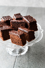 Homemade Moist Chocolate Sponge Cake Brownie Pieces in Vintage Glass Dessert Stand.
