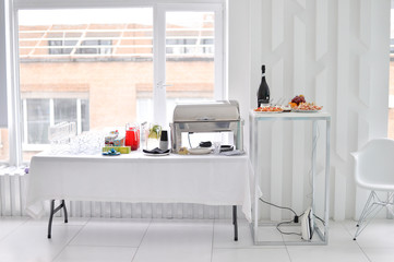 Beautiful european buffet. A lot of food for breakfast. White table. 