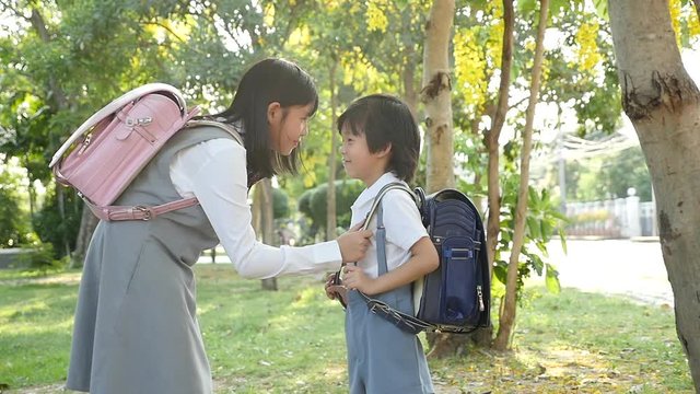 Cute Asian children going to the school outdoors slow motion 