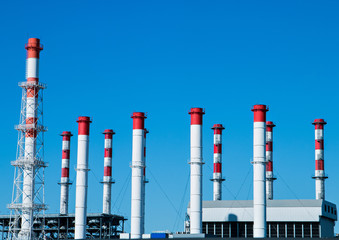 Obraz premium industrial enterprise against a blue sky