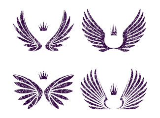 Fototapeta na wymiar Set of four pairs of wings with crowns in gtunge style. Vector illustration.