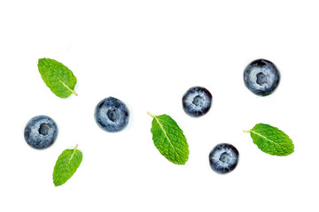 Blueberries isolated on white background. Fresh blueberry fruits close up, flat lay.