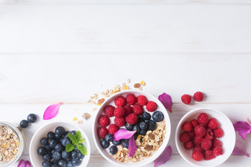 Smoothie bowl with yogurt, fresh berries and cereal
