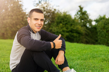 Man in sports clothes on grass