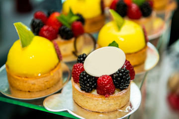 Delicious sweets on candy buffet. Lot of colorful desserts