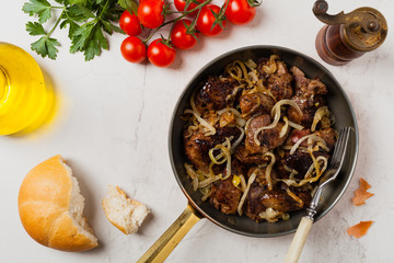 Fried chicken liver with onions.