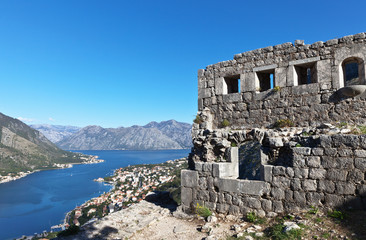 Montenegro. Kotor. Ruins of an ancient stone defensive fortress on a hill above a beautiful Old Town and Kotor Bay