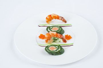 Fish snack with spinach roll.