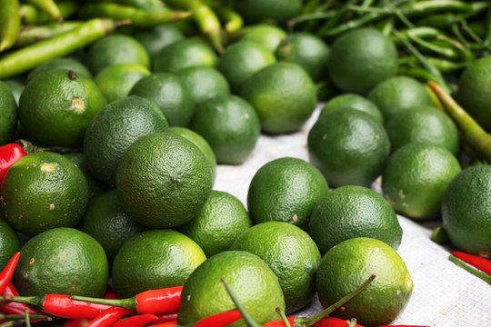 Green Lime with different chilli at market