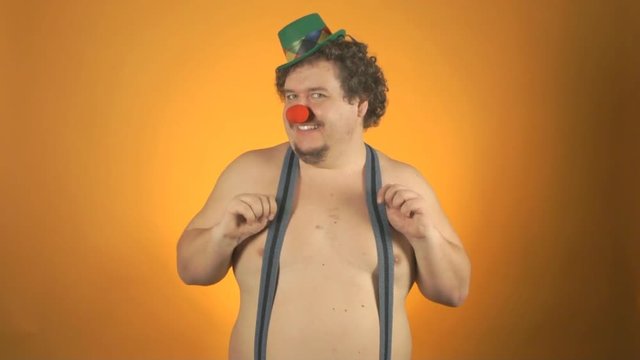 Funny fat clown. Shirtless. Surprise and joy. 