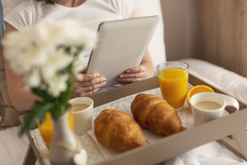 Woman surfing the web on a tablet computer