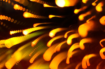 Shining light bulb with firework effect. Abstract background, closeup photo