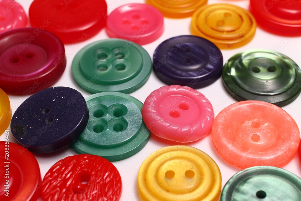 Poster colored buttons on a white background close up