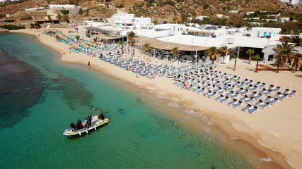 Fototapeta na wymiar Aerial drone, bird's eye view photo of iconic and famous beach of Super Paradise with sapphire clear waters, Mykonos island, Cyclades, Greece