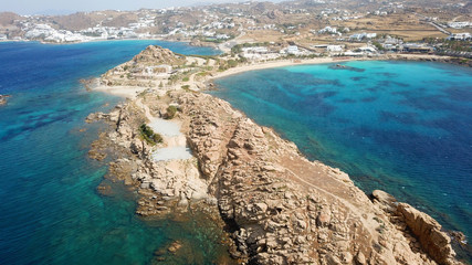 Aerial drone bird's eye view of famous Paraga beach featuring iconic beach bar of Skorpios and...