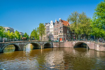 Amsterdam, May 7 2018 - The corner of Keizersgracht and Leidsegracht with tourist enjoying the city...