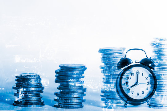 Double exposure rows of coins with clock and city background, Finance and business background concept