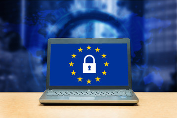General Data Protection Regulation - laptop on a table, blue screen with GDPR