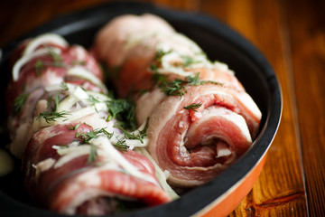 Roll of meat with various spices and herbs