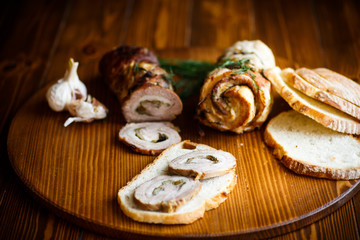 Roll of meat with various spices and herbs