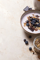 Smoothie bowl with yogurt, fresh berries and cereal