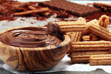 Traditional Spanish dessert churros with sugar and chocolate