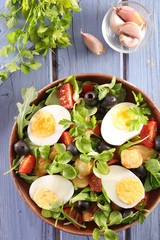 salad with egg, tomato, potato and olive