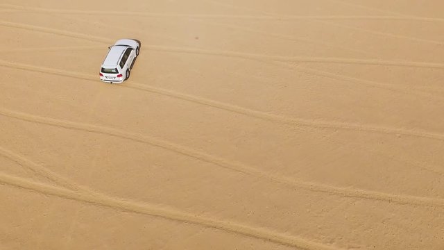 4x4 vehicle driving off road. Stock. Sand dune all-terrain car. Aerial