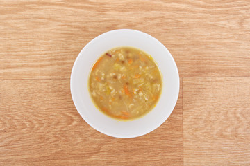 Soup with pasta and vegetables on a table