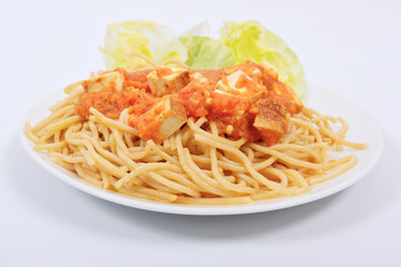 Bolognese spaghetti with tofu on a white