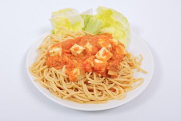 Bolognese spaghetti with tofu on a white