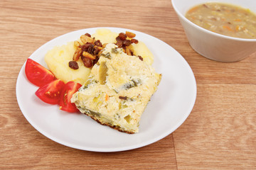 Baked leek with mashed potatoes on a table