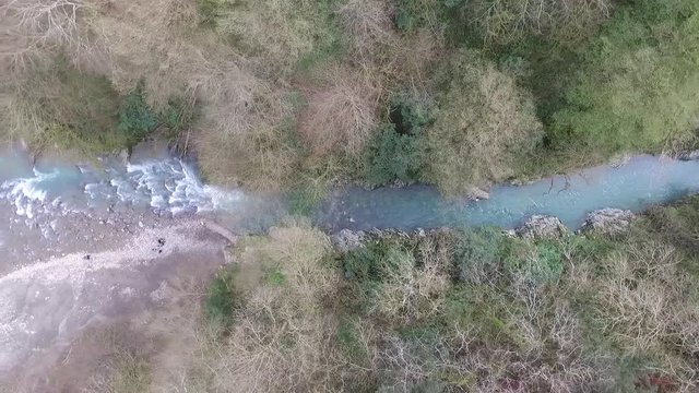 Top-down drone view of Khosta River and forest of Devil's Gate Canyon, Sochi, Russia
