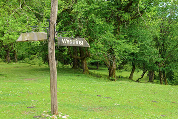 A wooden sign with the inscription 