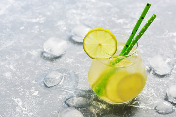 Cocktail drink with lime and ice. A refreshing summer drink. The concept of summer. Place for text.