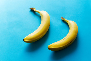 yellow bananas two blue summer background delicious