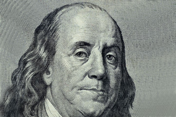 Benjamin Franklin close-up on a gray background