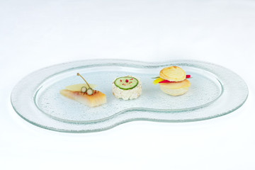 Obraz na płótnie Canvas Canape with Tartar on buffet glass dish.