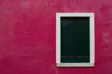 window shutters closed on red wall, Burano, Venice
