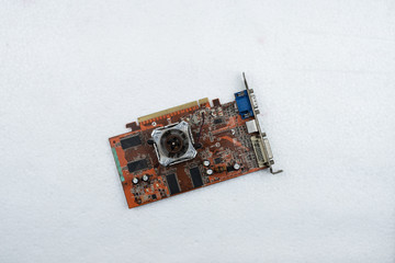 The computer mainboard,show detail of old and aged system board on background.