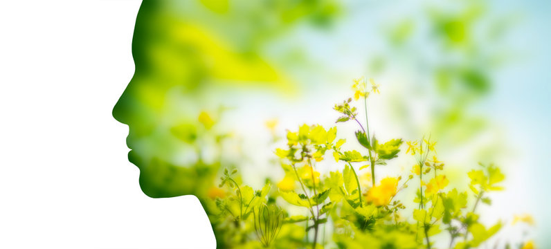 Beauty, Nature And Ecology Concept - Portrait Of Woman Profile With Yellow Spring Flowers With Double Exposure Effect