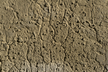 background, texture - brown clay wall with bumps and cracks