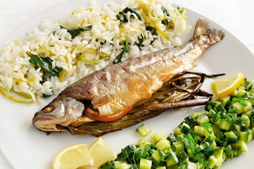 roasted trout stuffed with green onion and lemon with rice and green salad