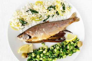 freshwater trout with leek spinach rice and cucumber onion salad