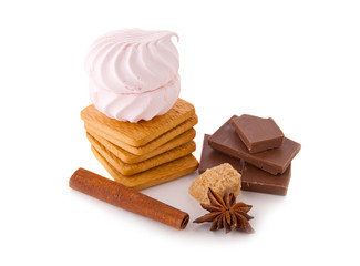 Cookies, chocolate, marshmallow and cinnamon on an isolated background