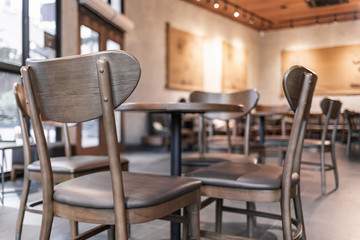 Fototapeta na wymiar Modern interior of coffee shop decorate with wooden furniture